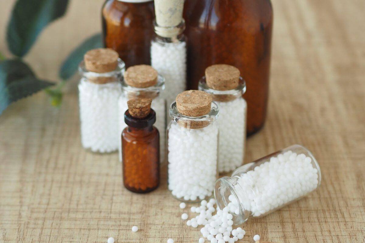 Homeopathic pills containers on a table