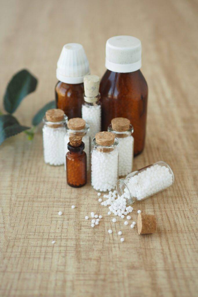 Homeopathic pills containers on a table.