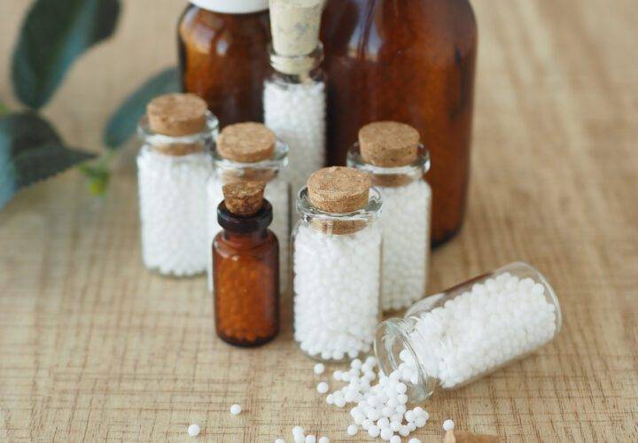 Homeopathic pills containers on a table